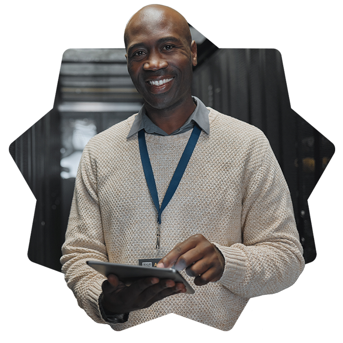 Man holding tablet in server room