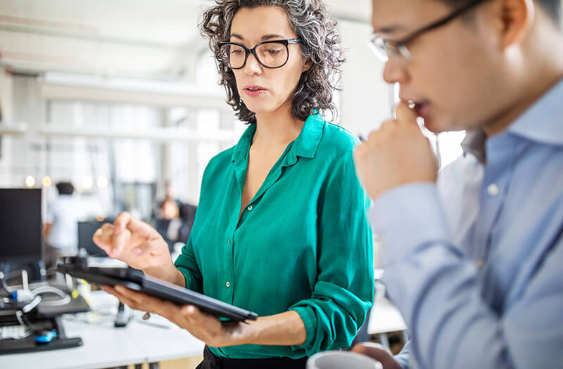 Technology planning session featuring a tablet computer during a walk-and-talk meeting.