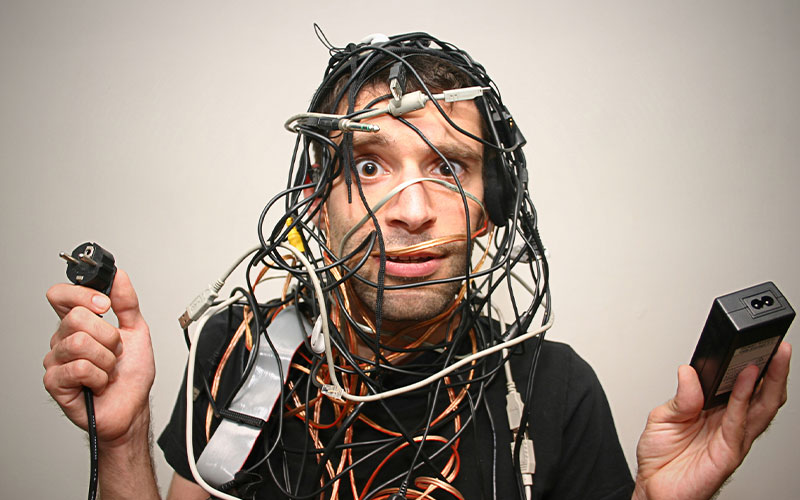 Man holding tangled wires