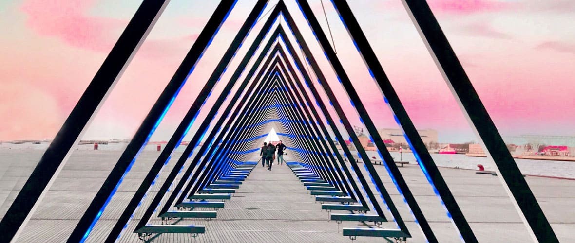 People walking though a triangle