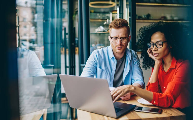 Adobe VIP for Creative Cloud® ensures apps are always up to date with the newest capabilities Two coworkers collaborating together