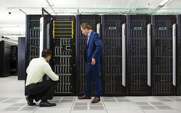 Two men working in server room