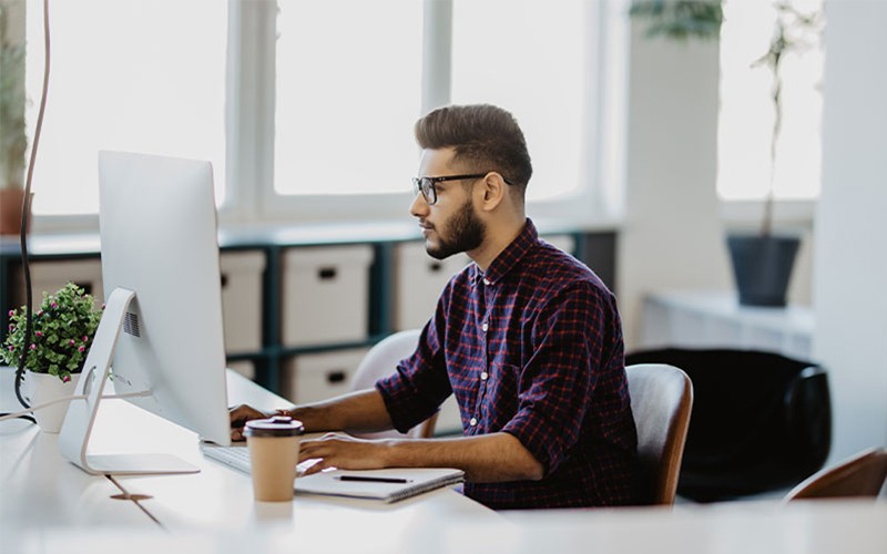 2229513-microsoft-azure-workshops-2023-04-10 man typing on keyboard with cloud security symbol