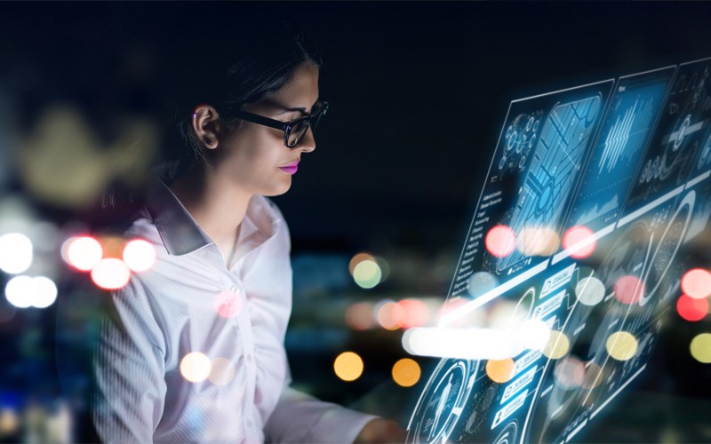 power-your-security-image woman with laptop surrounded by binary code